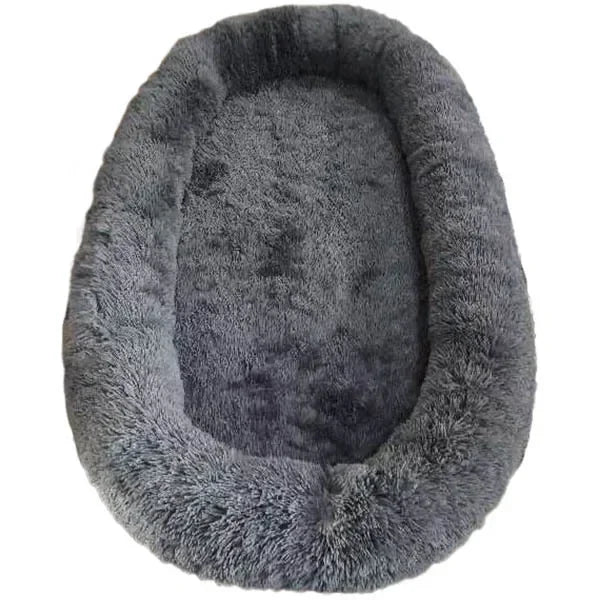 A giant plush sponge dog bed for human use to keep warm in winter as a pet bed. People and dogs share leisure mattresses